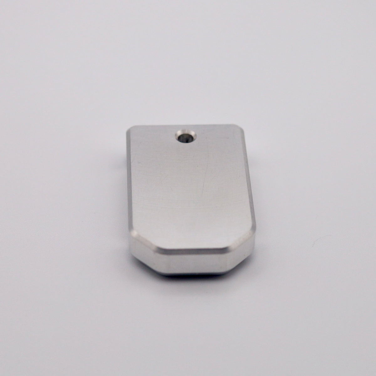Close-up of machined aluminum base plate for PSA Micro Dagger magazines.