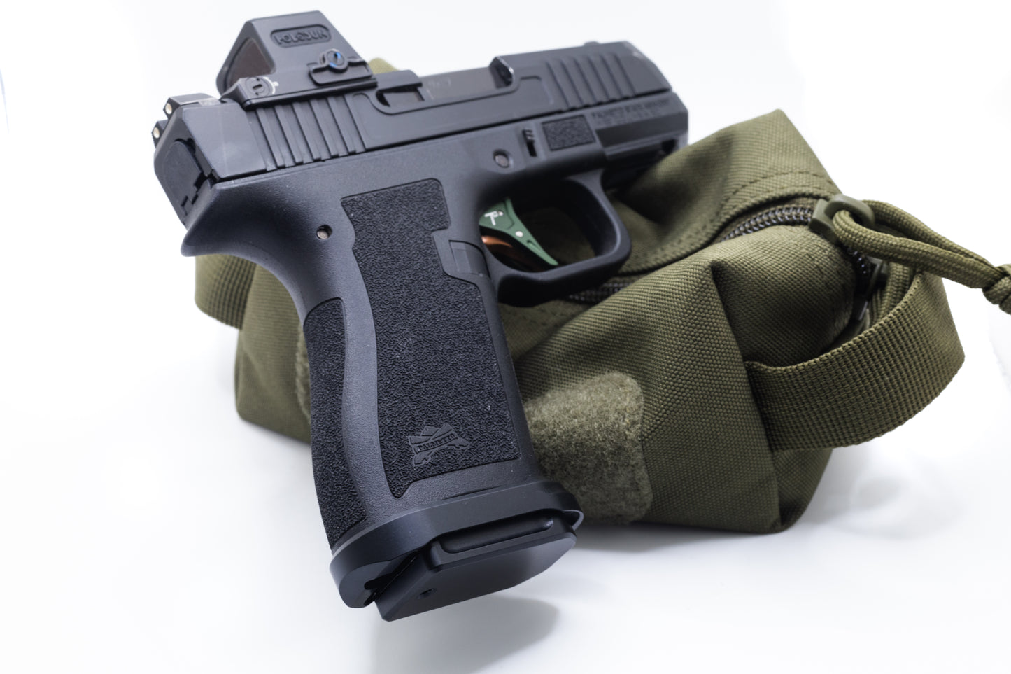 CC Magwell for PSA Micro Dagger in black on a green tactical pouch, showcasing improved grip and concealed carry design.